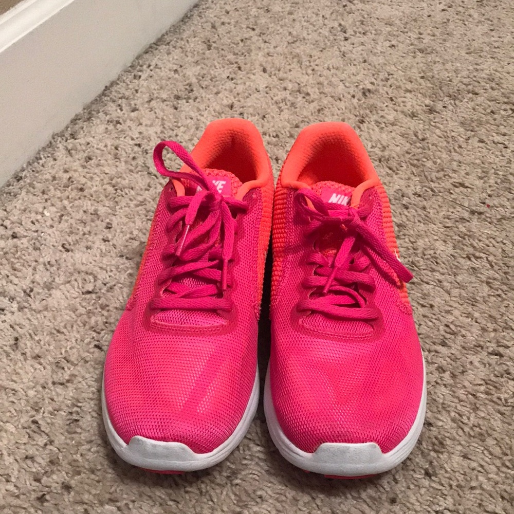 Pink and orange Nike revolution 3 shoes